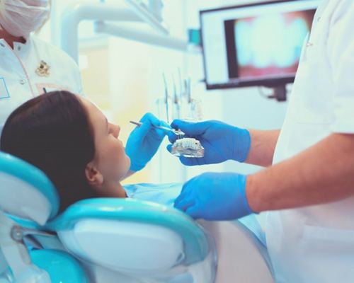 Dentist treats patient