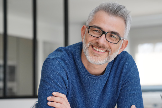 closeup of man smiling after getting dentures